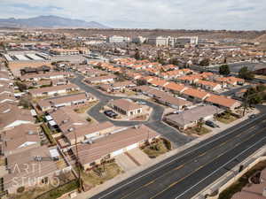 Birds eye view of property featuring a mountain view