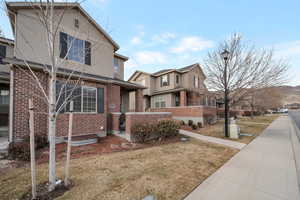 View of front of property with a front yard