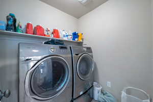 Laundry room with washing machine and dryer