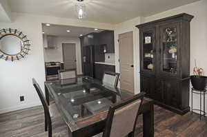 Dining area featuring dark hardwood / wood-style flooring