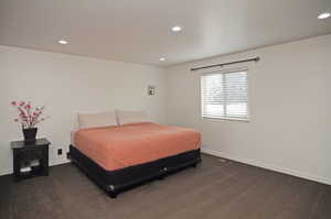 Bedroom with dark carpet