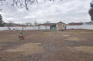 View of yard featuring a shed