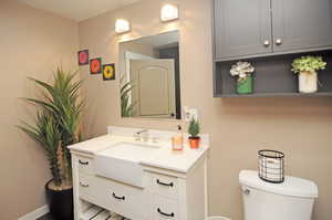 Bathroom featuring vanity and toilet