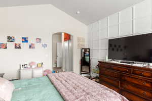 Bedroom featuring vaulted ceiling