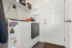 Laundry area with washing machine and clothes dryer