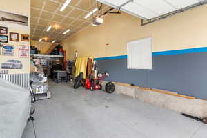 Garage featuring a garage door opener