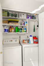 Laundry area featuring washing machine and clothes dryer