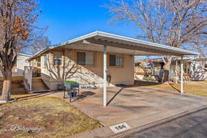 View of front of house featuring a carport