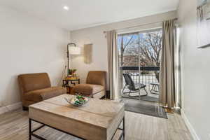 Living area with light hardwood / wood-style floors