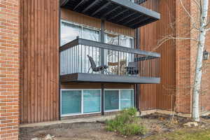 View of side of property featuring a balcony