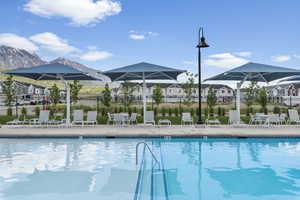 View of swimming pool with a mountain view