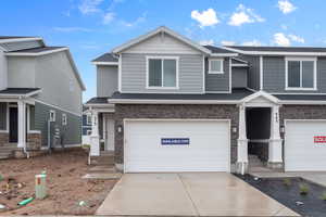 View of front facade featuring a garage