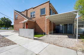 View of front facade with a carport