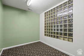 Unfurnished room featuring carpet flooring