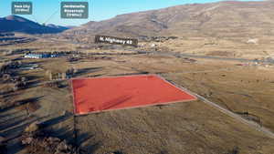 Birds eye view of property with a mountain view and a rural view