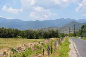 Property view of mountains with a rural view