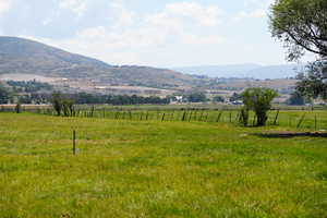 Property view of mountains featuring a rural view