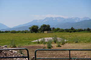 Property view of mountains with a rural view