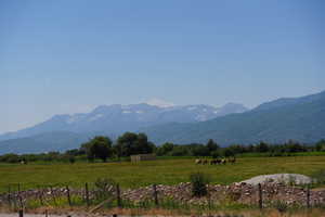 Property view of mountains with a rural view