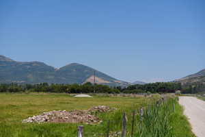 Property view of mountains with a rural view