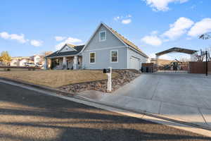 View of front property with a garage and a porch