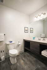 Bathroom featuring vanity and toilet