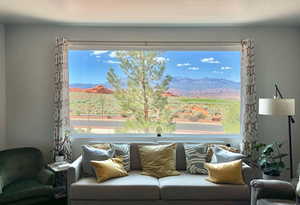 Living room with a mountain view and a wealth of natural light