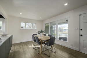 Dining area with hardwood / wood-style flooring