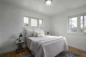 Bedroom featuring dark hardwood / wood-style flooring