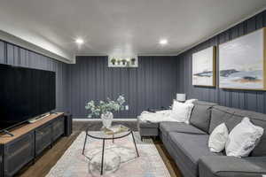 Living room with dark hardwood / wood-style floors