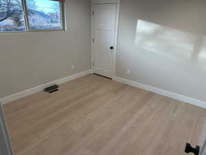 Spare room featuring light hardwood / wood-style floors