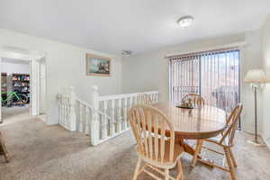 View of carpeted dining space