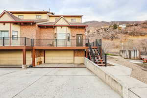 View of front facade featuring a garage and a mountain view