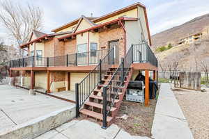 View of front of property with a mountain view and a garage