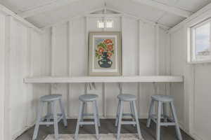 Walk in closet featuring vaulted ceiling