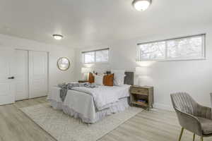 Bedroom featuring a closet and light wood-type flooring