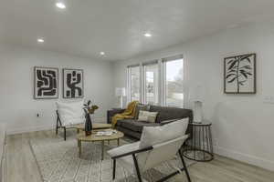 Living room with light wood-type flooring