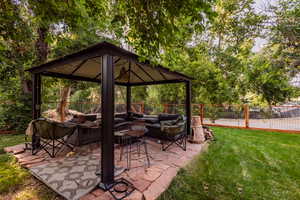 View of patio / terrace featuring a gazebo and an outdoor living space