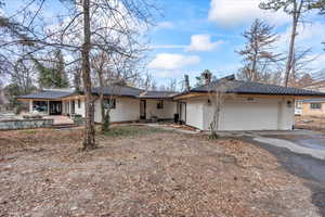 Single story home featuring a garage