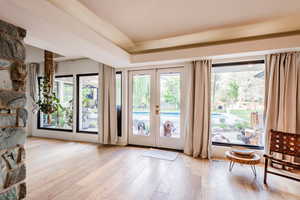 Entryway featuring light hardwood / wood-style floors and french doors