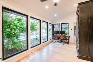 Office featuring lofted ceiling and light hardwood / wood-style flooring