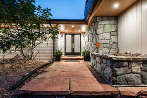 Doorway to property featuring french doors