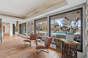 Sunroom featuring french doors and a tray ceiling