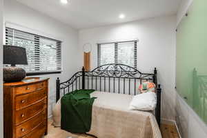 Bedroom with light hardwood / wood-style floors