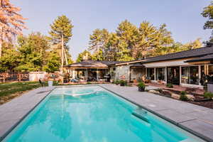 View of swimming pool with a patio