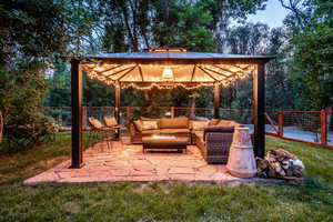 View of patio / terrace featuring a gazebo and an outdoor hangout area