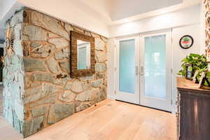 Entryway featuring light hardwood / wood-style floors and french doors