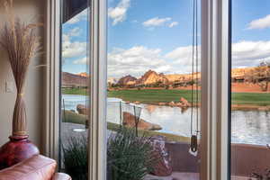 Entryway featuring a wealth of natural light and a water view