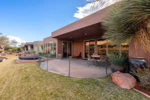 Exterior space with a lawn and a patio area