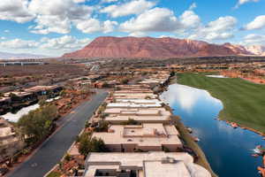 Birds eye view of property featuring a water and mountain view